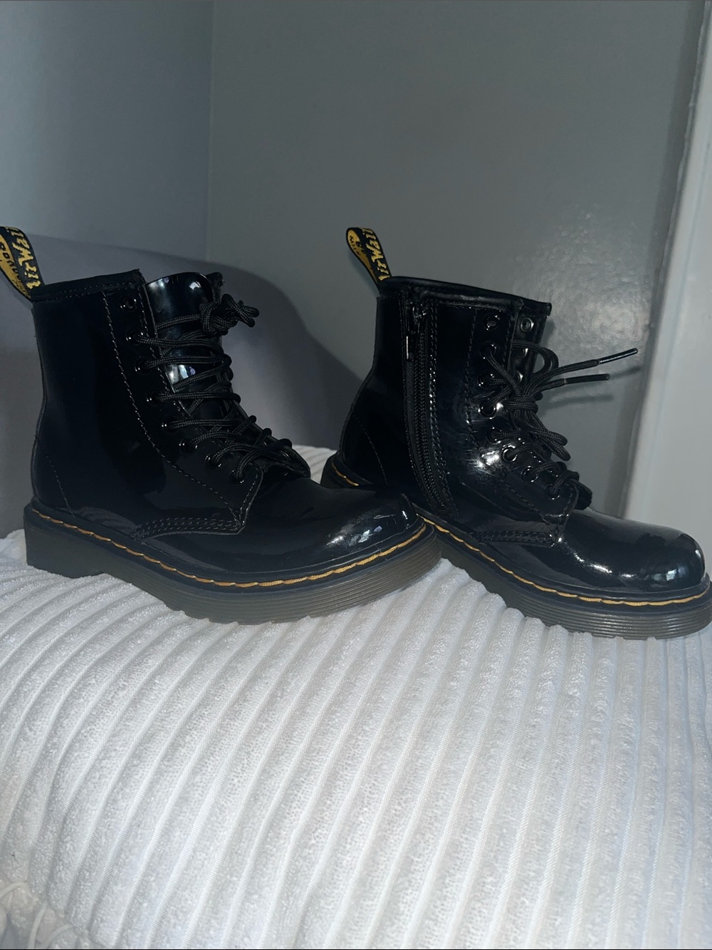 Dr. Martens Black Patent Combat Boots with Yellow Stitching